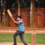 Man Playing Cricket