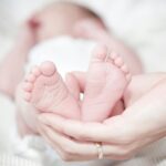 Close-up of Hands Holding Baby Feet